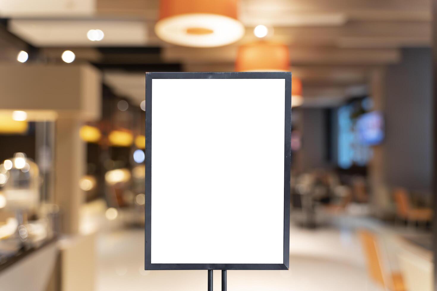 Vertical empty advertising poster mock-up at the entrance of restaurant photo