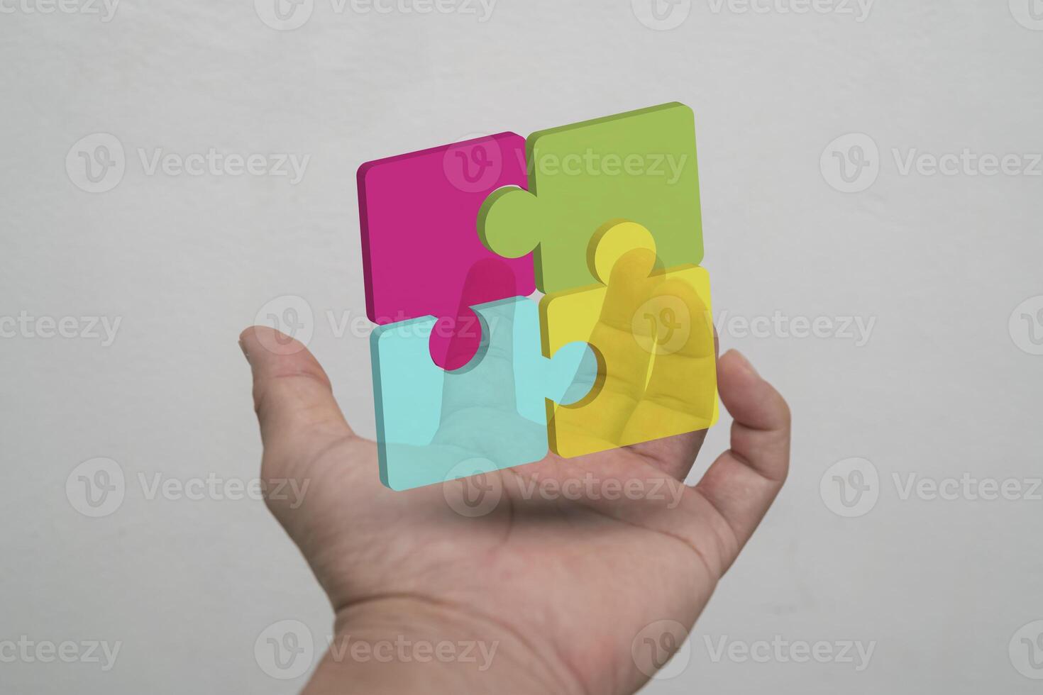Four puzzle pieces make up a square for a business choice idea. photo