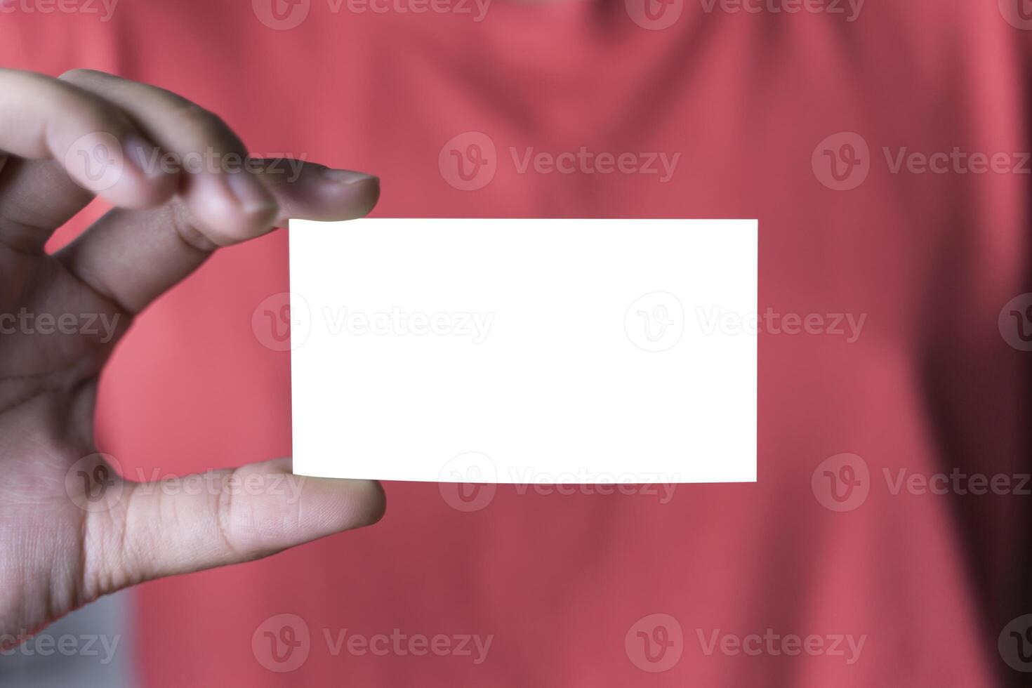 Business woman holding and showing credit or id card. closeup of blank plastic card in female hand. photo
