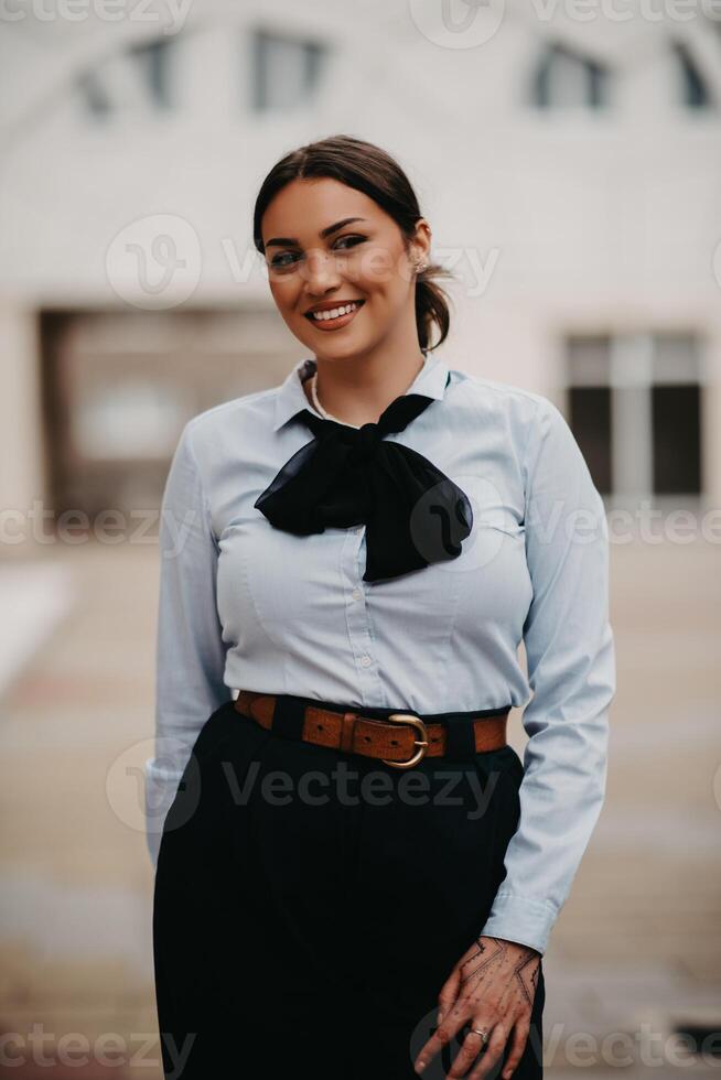Smiling Latina businesswoman strides confidently through urban streets. photo