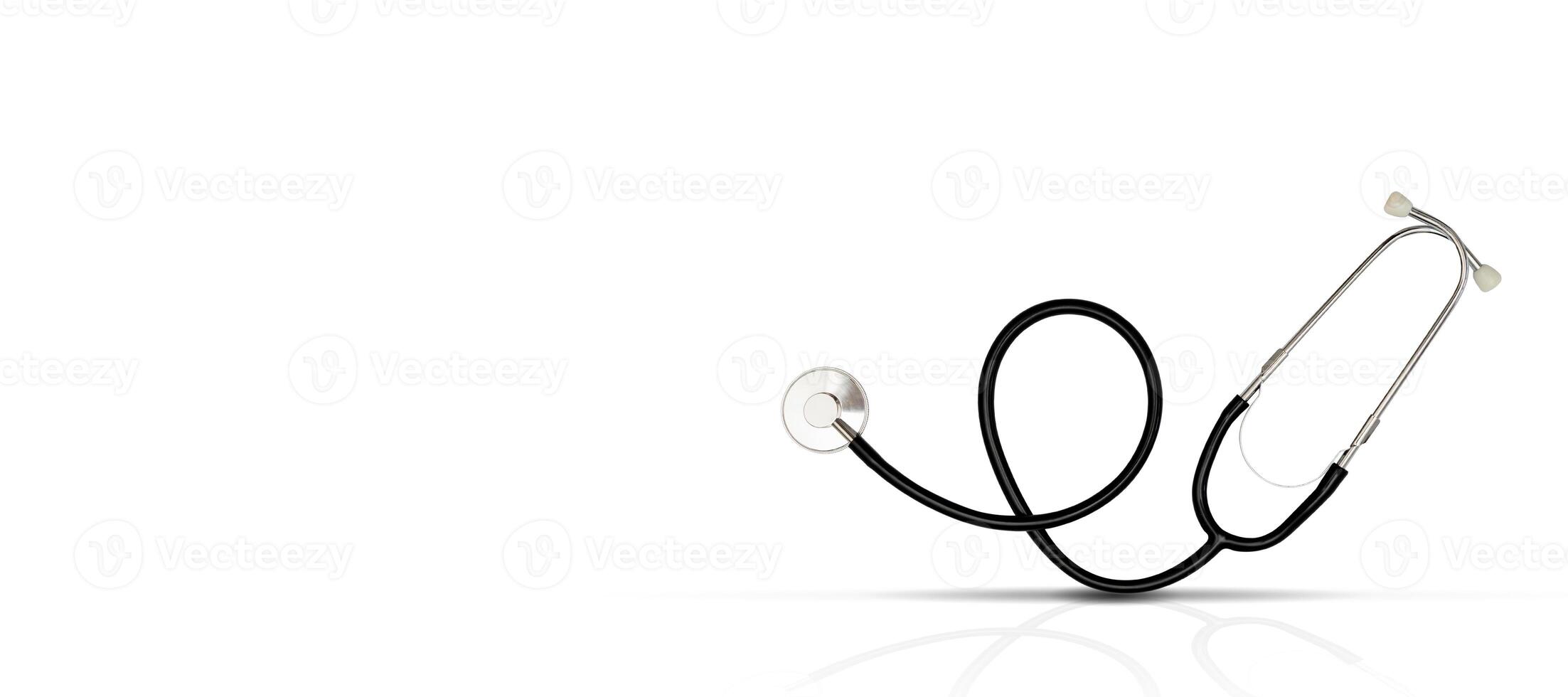 Headphones on a white background are reflected into shadows. Medical stethoscope. photo