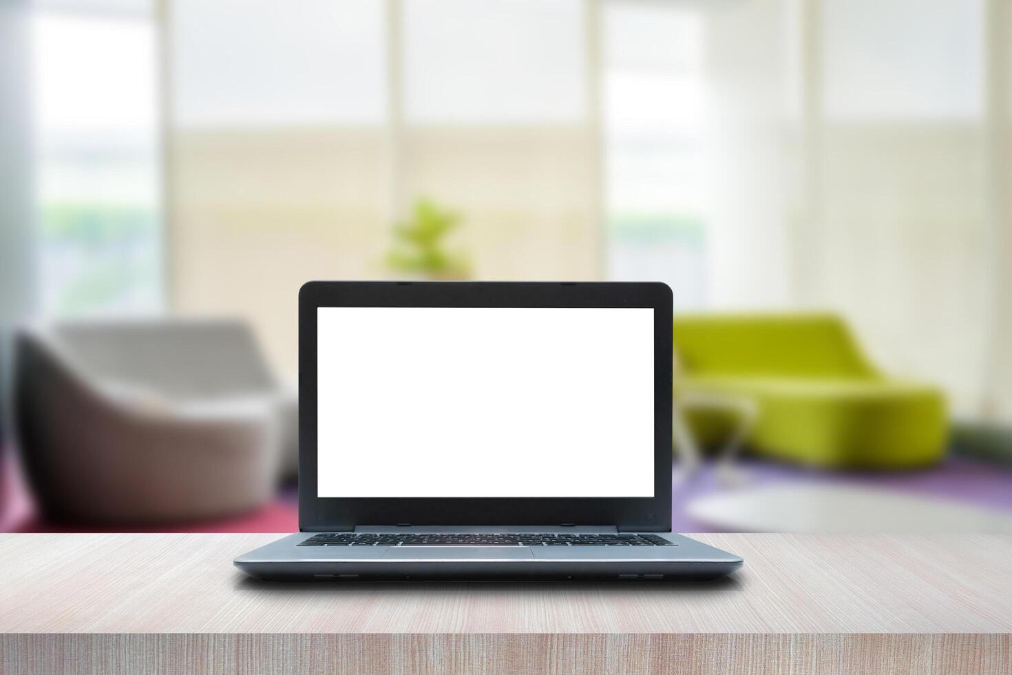 Laptop computer blank white screen on table. Reception room. interior of a waiting room, modern office photo