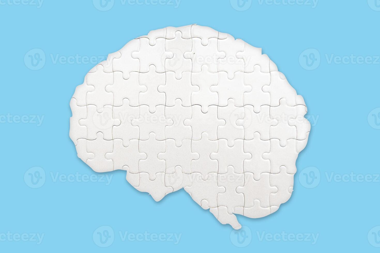 Brain jigsaw puzzles to be placed separately on blue. The concept of treating brain disorders photo