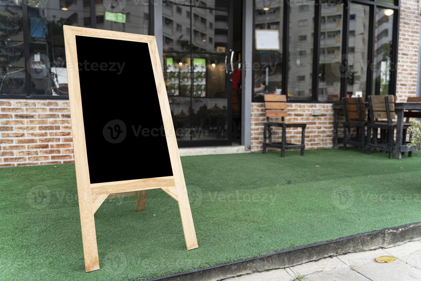 Mock up chalkboard sign stand cafe menu shop front restaurant background photo