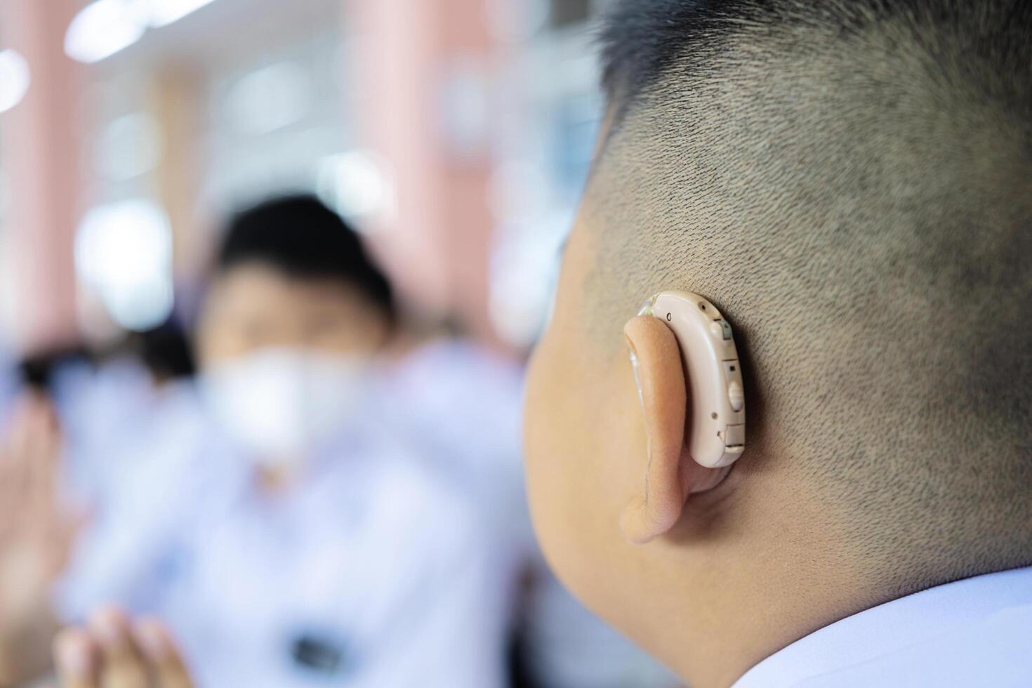 Little boy with hearing aid, closeup photo