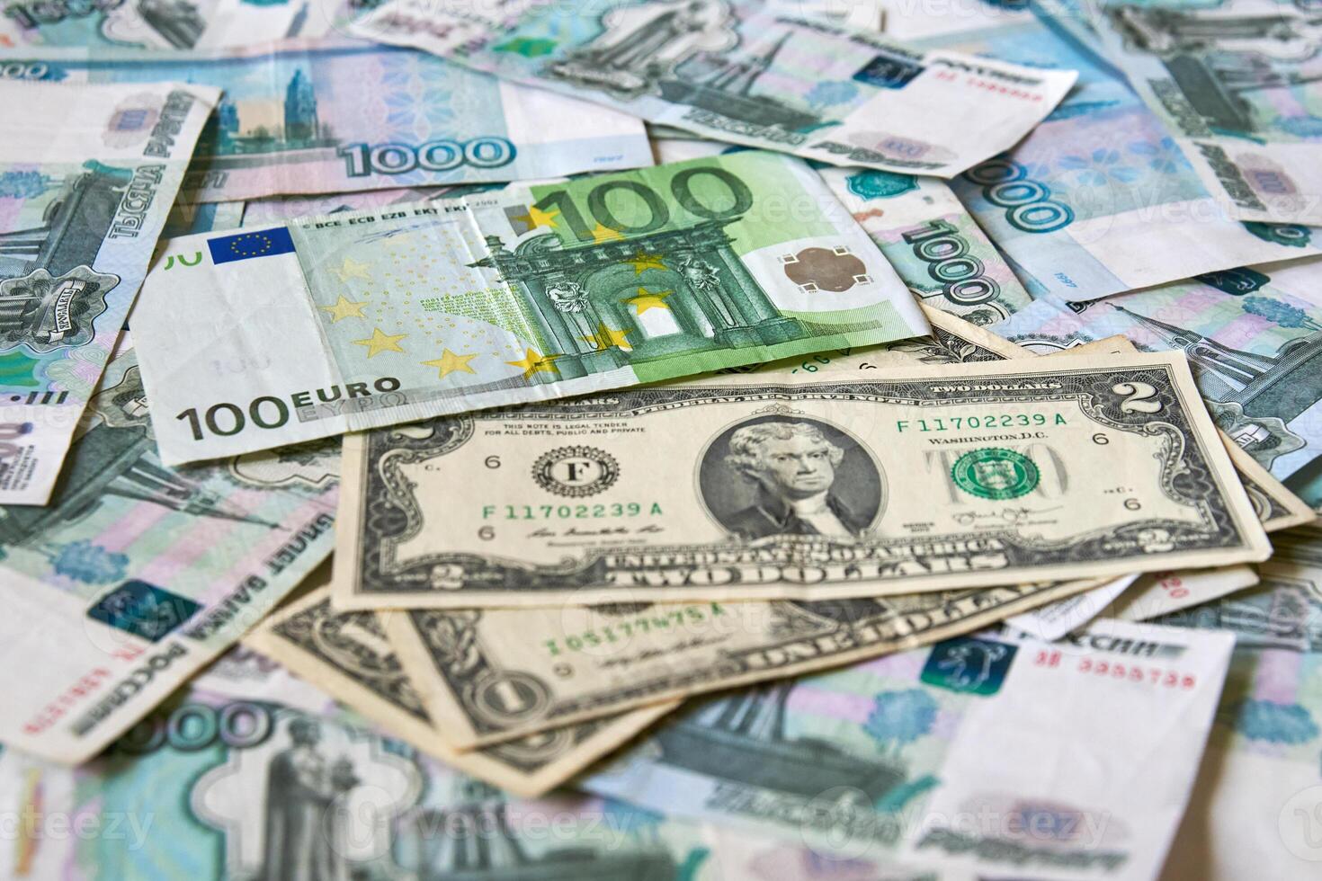 background of paper bills dollars, euros and rubles. Currency exchange rate photo
