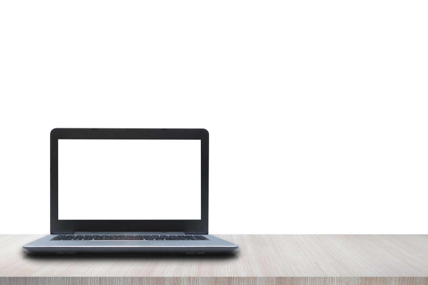 Laptop blank screen on wooden table isolated on white background. Can add background images and text photo