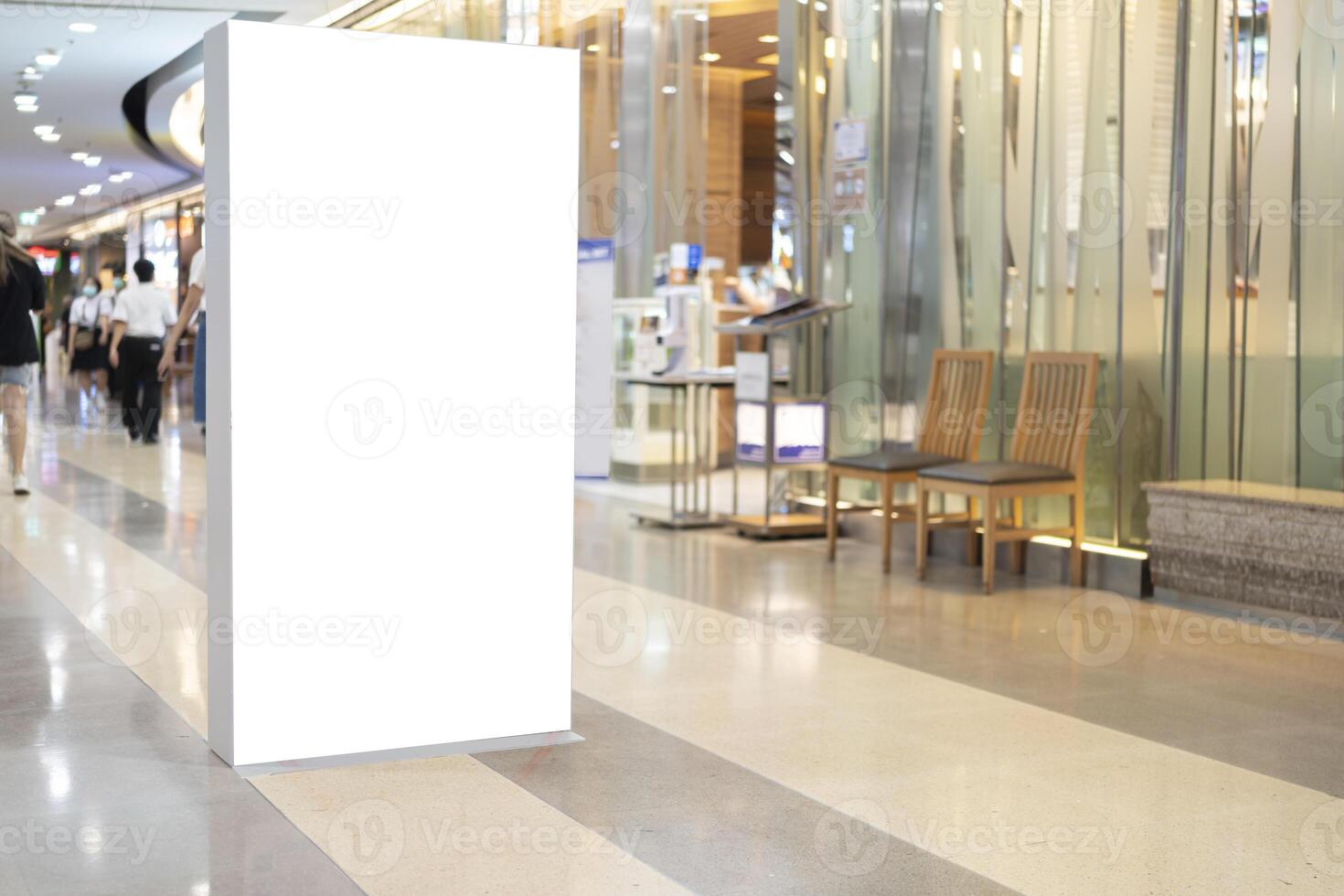 blank showcase billboard or advertising light box for your text message or media content with escalator in modern department store shopping mall, shopping center photo