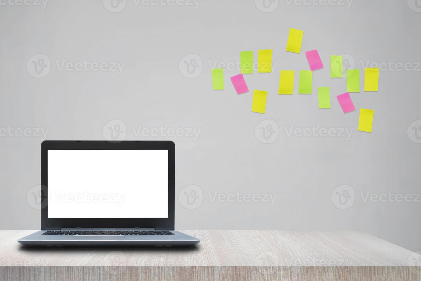 Modern creative workplace with laptop notebook mock up white empty screen on desk with moodboard sticky notes photo