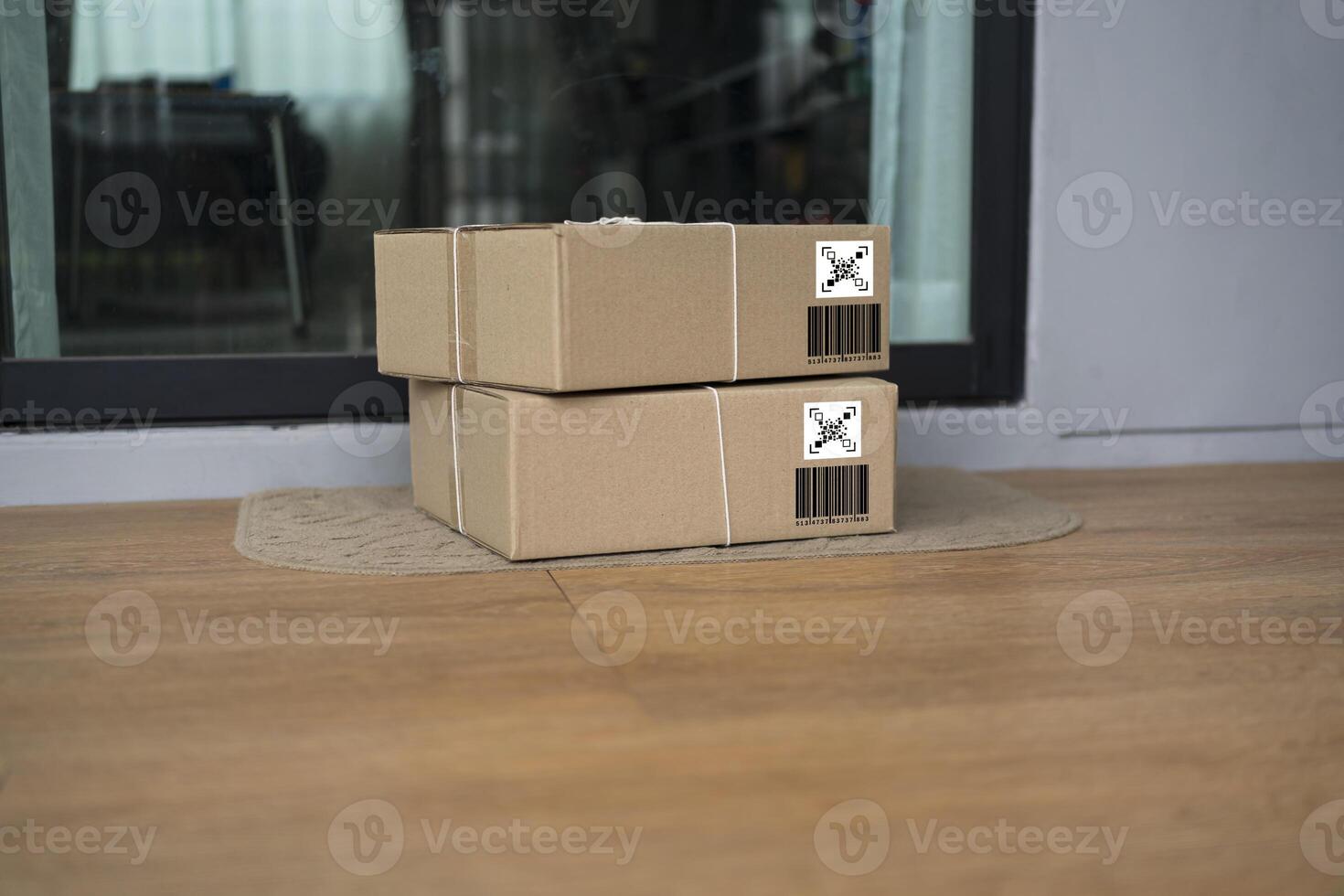 Express package delivery service concept, parcel box wrapped in craft paper on the door mat photo