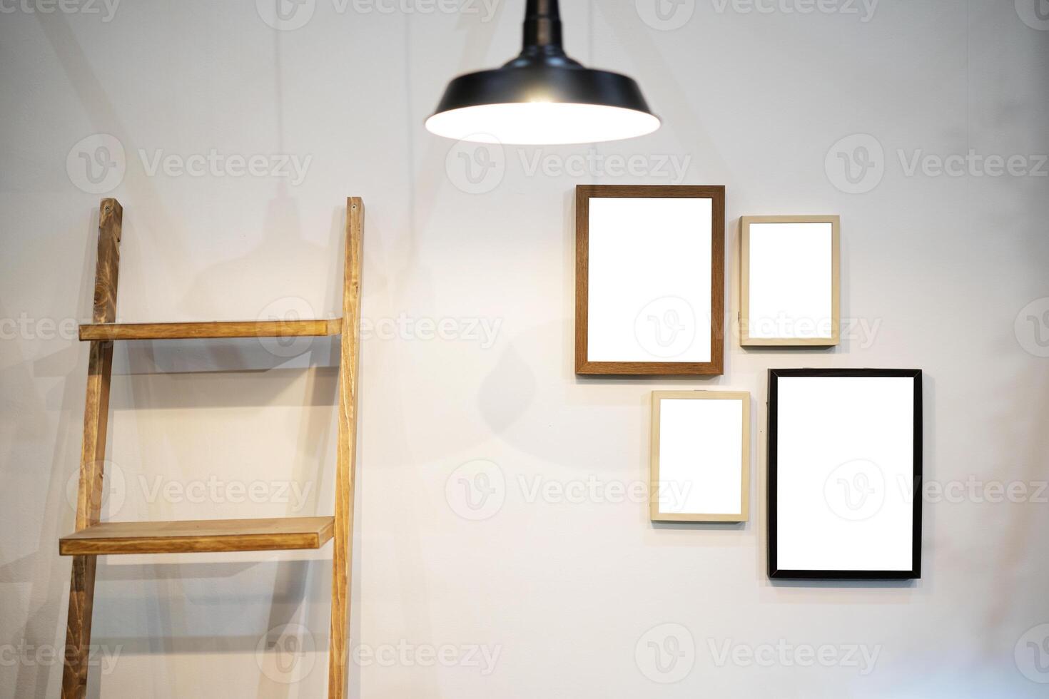 Cropped shot of stylish workspace with mock up frame, stationery in living room. photo