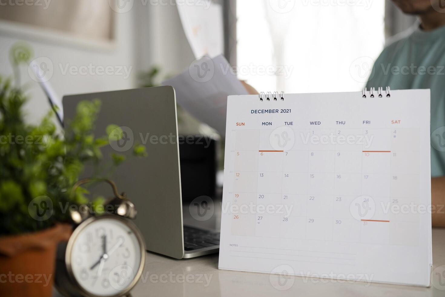 New year at work concept. The man is working hard in the last month of the year. photo
