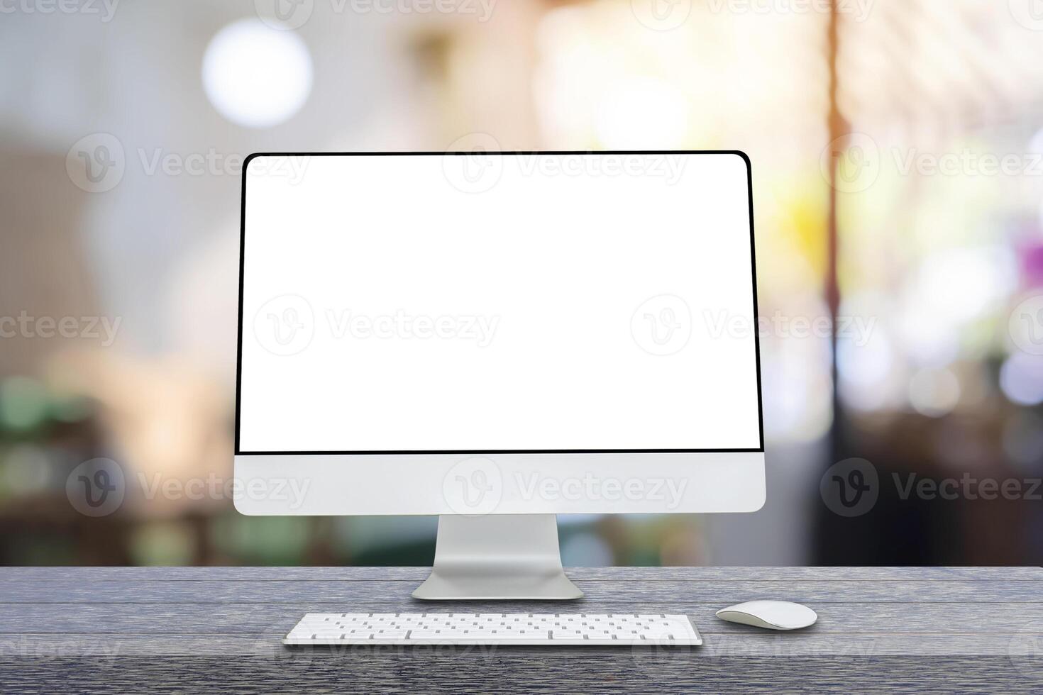 Computer monitor with wireless mouse and keyboard over blurred vintage office photo