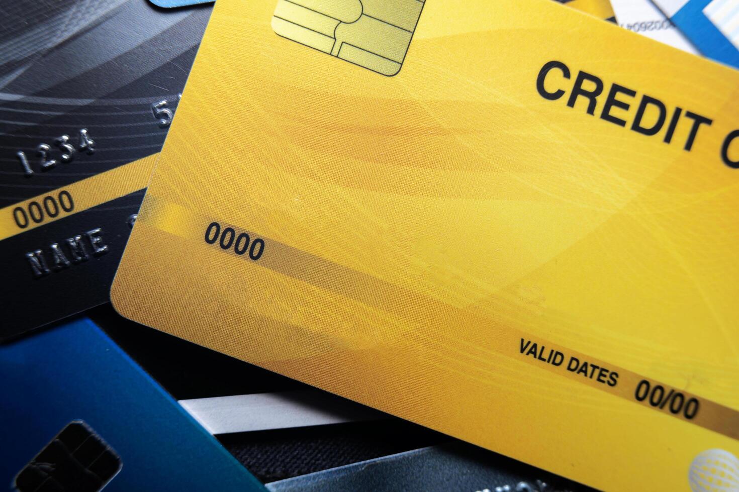 Credit card close up shot with selective focus. Lots of overlapping credit cards photo