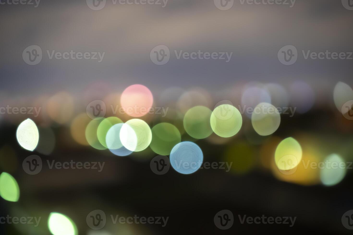 Light night city, light bokeh. Blur effects with photo camera taken from the city at night