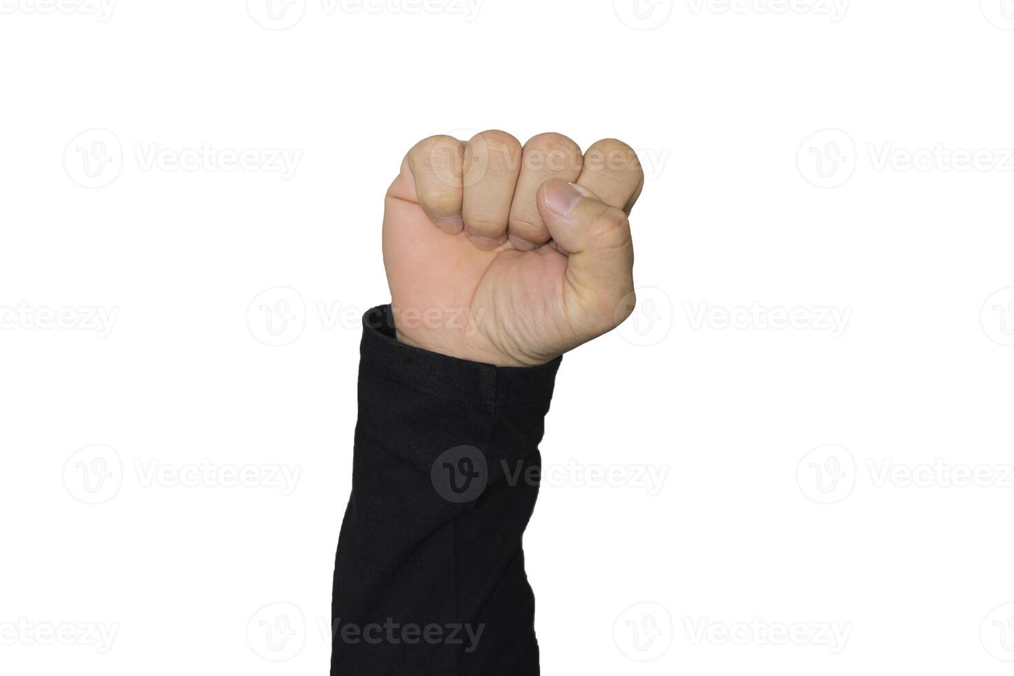 A clenched male fist is up in the air photo