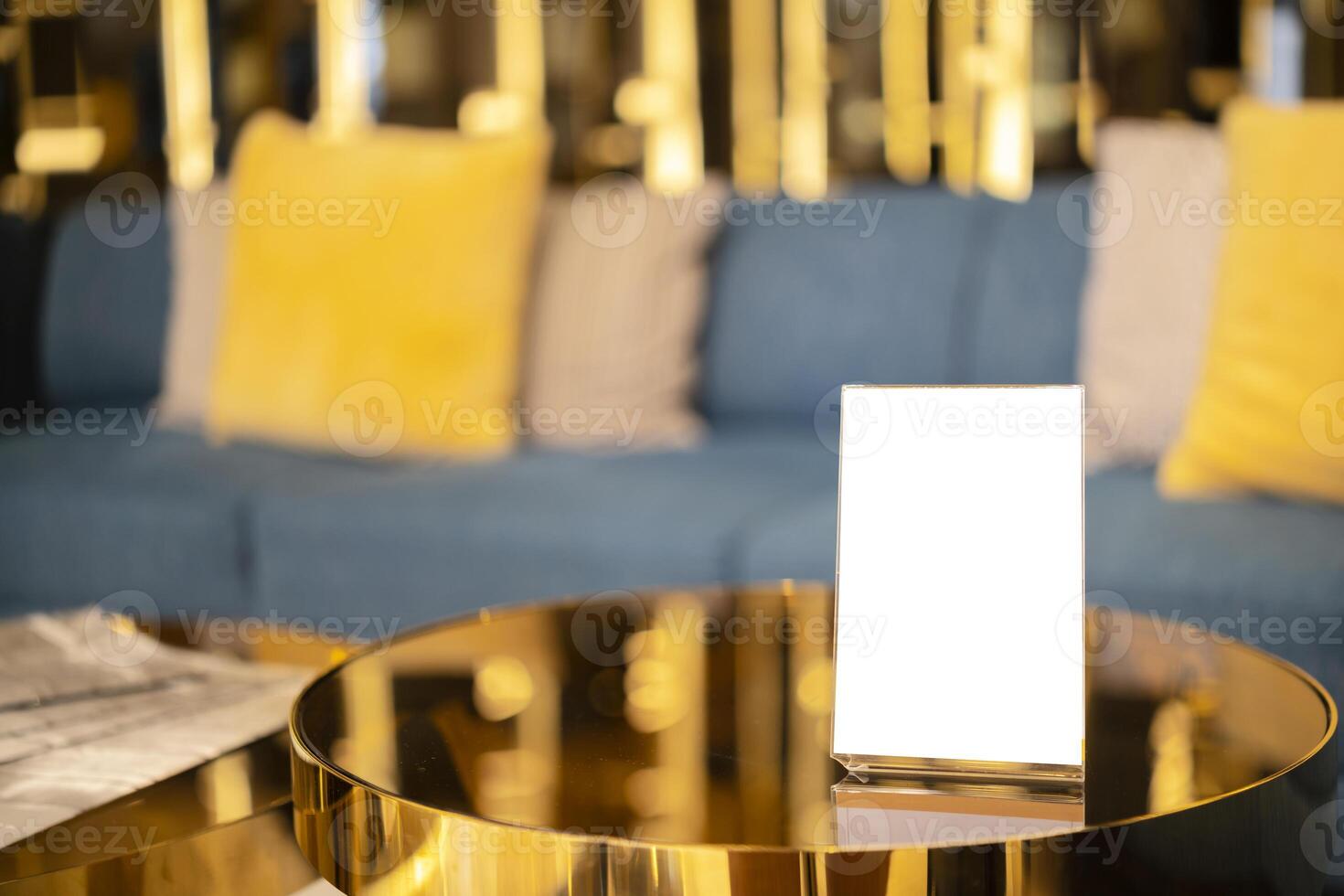 Mock up Menu frame standing on wood table in Bar restaurant cafe. photo