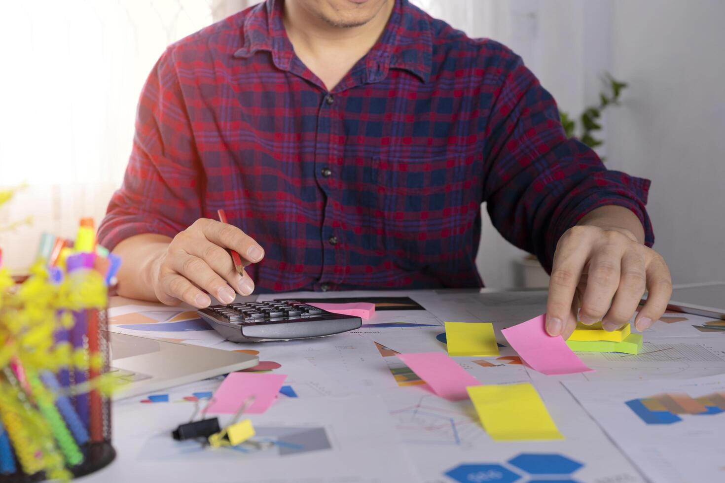 Businessman workers posting with sticky notes stickers reminders creative brainstorming photo