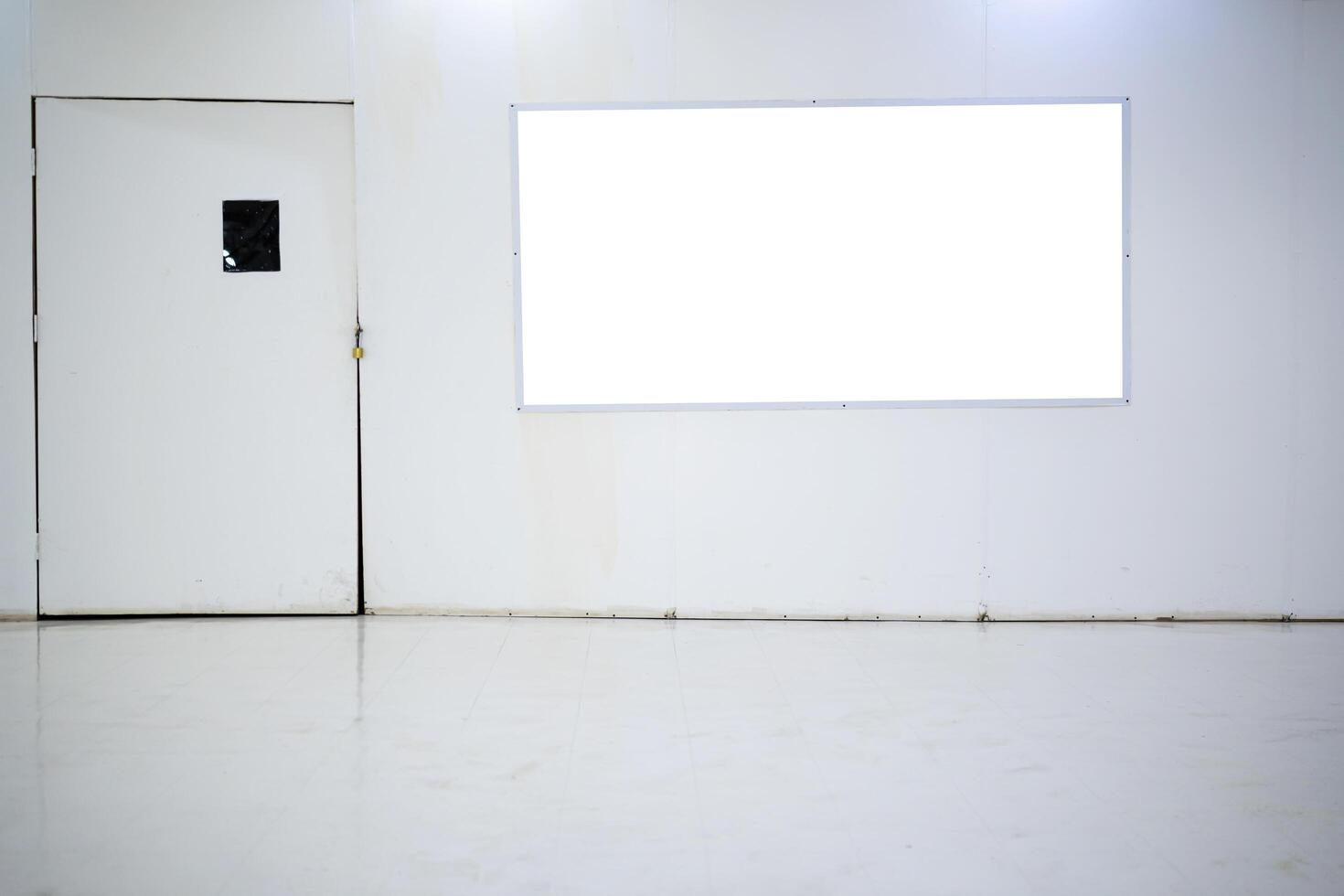 An empty billboard inside a shopping mall that is currently closed for renovations. photo