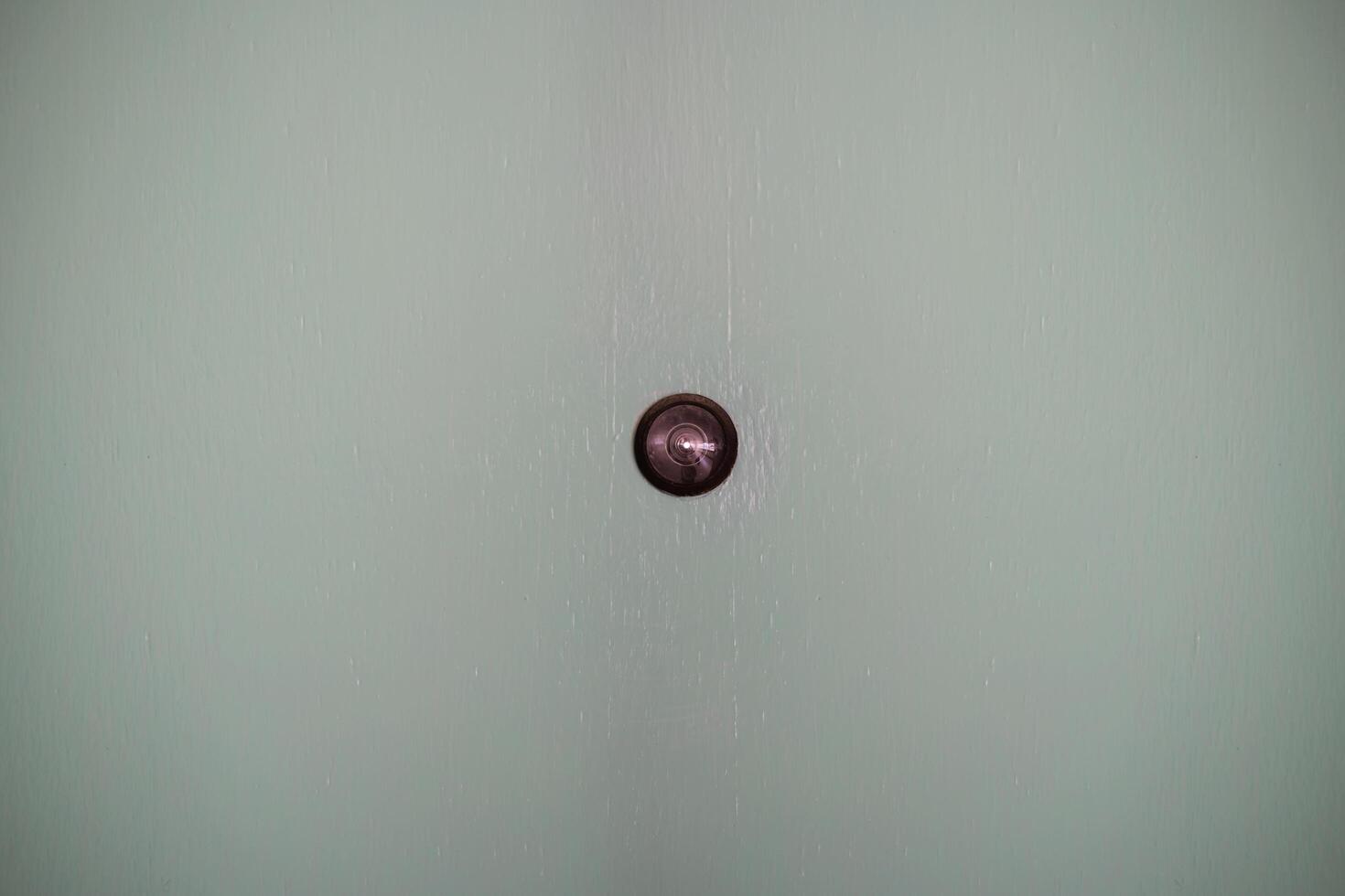 Peephole isolated on blue background. photo