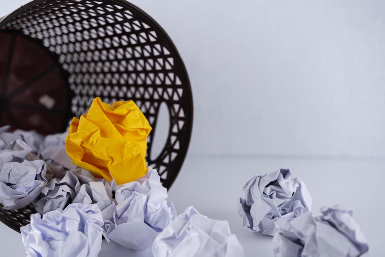 Crumpled paper in the trash can, white crumpled paper bal photo