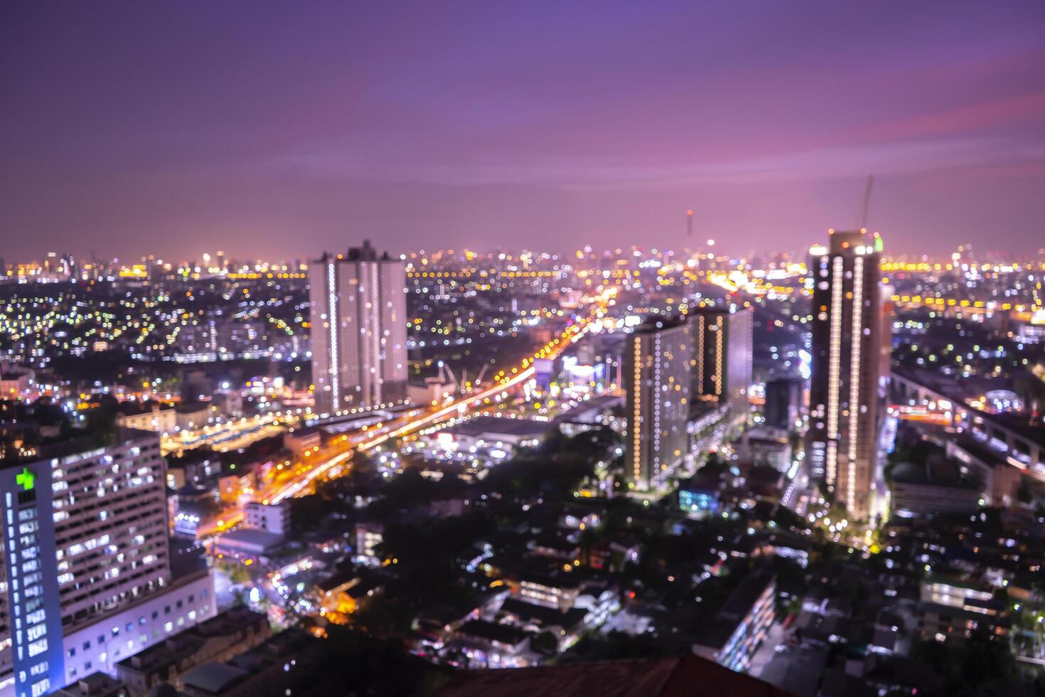 Bokeh light and blur office view of city background. Bangkok photo