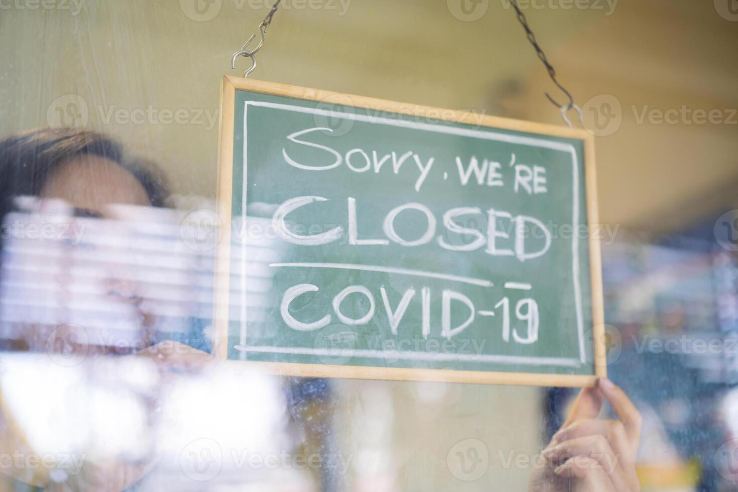 Stressed owner forced to close the restaurant permanently due to restrictions on the coronavirus. photo