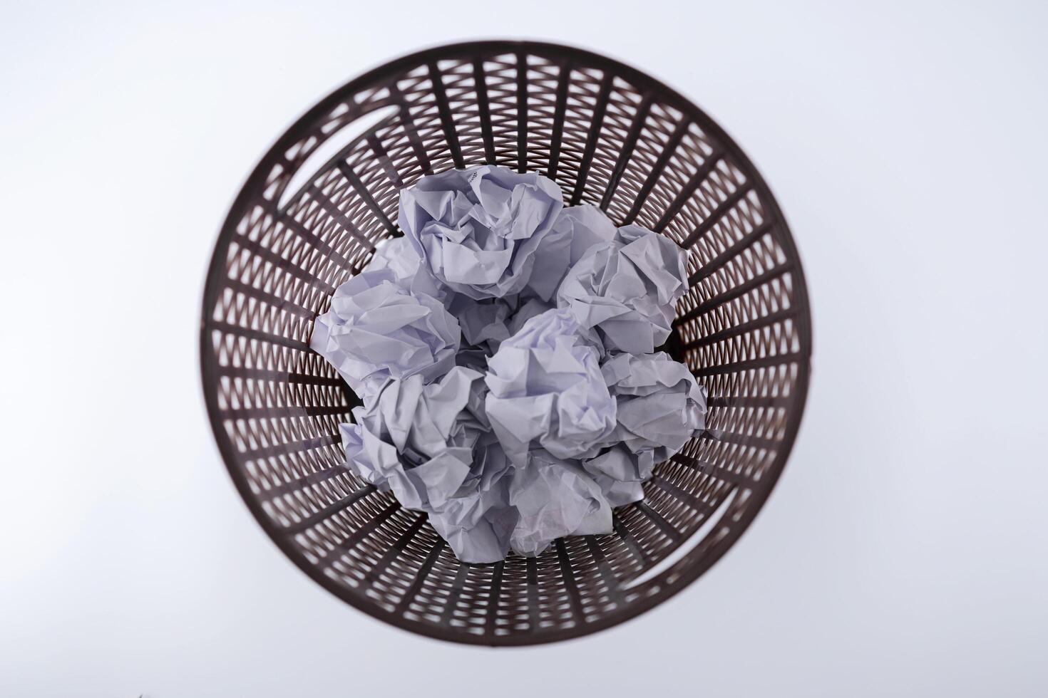 The crumpled paper that was thrown into the trash As if you were throwing away a good idea photo