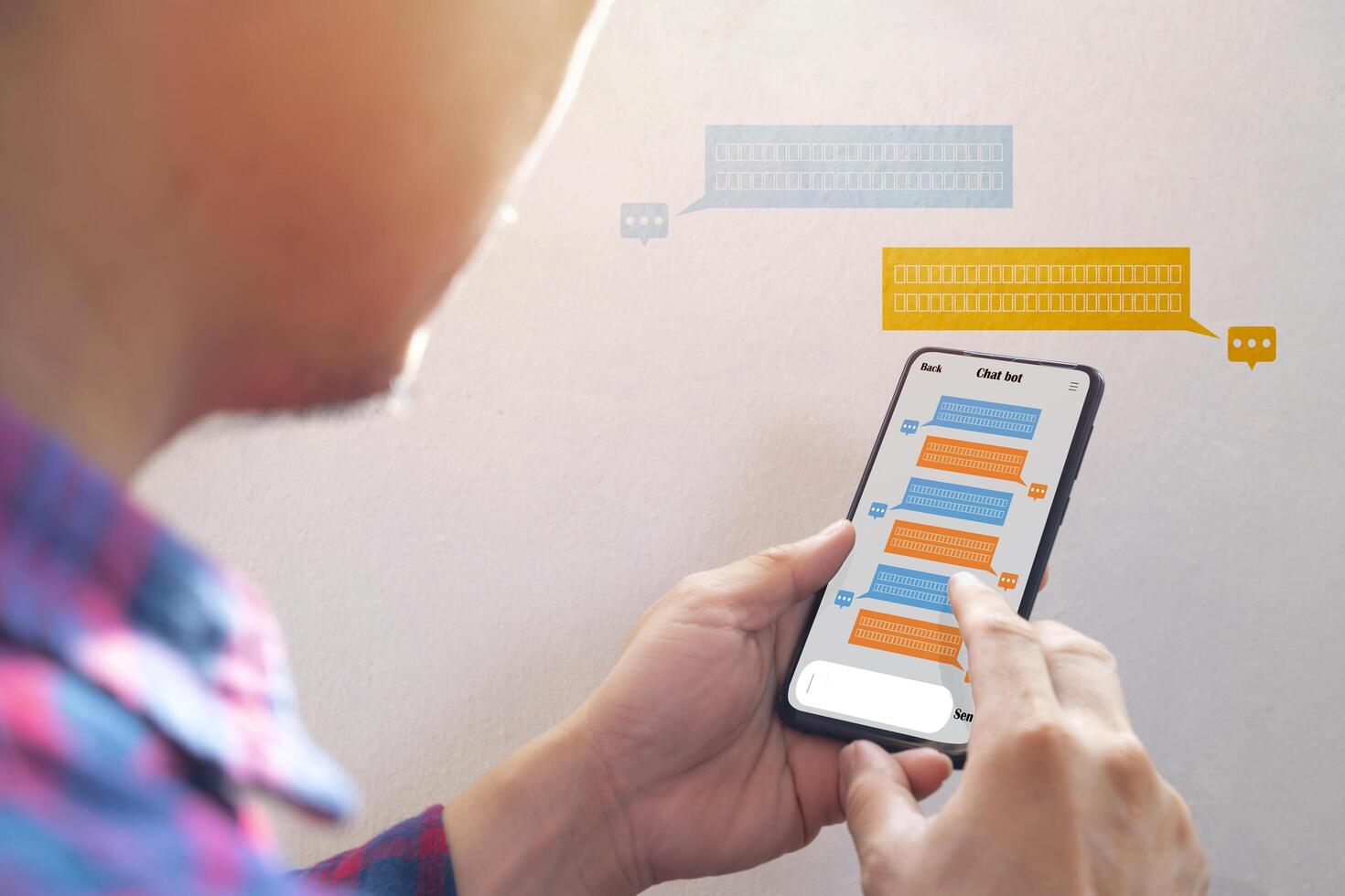 chatbot via mobile smart phone application while working photo