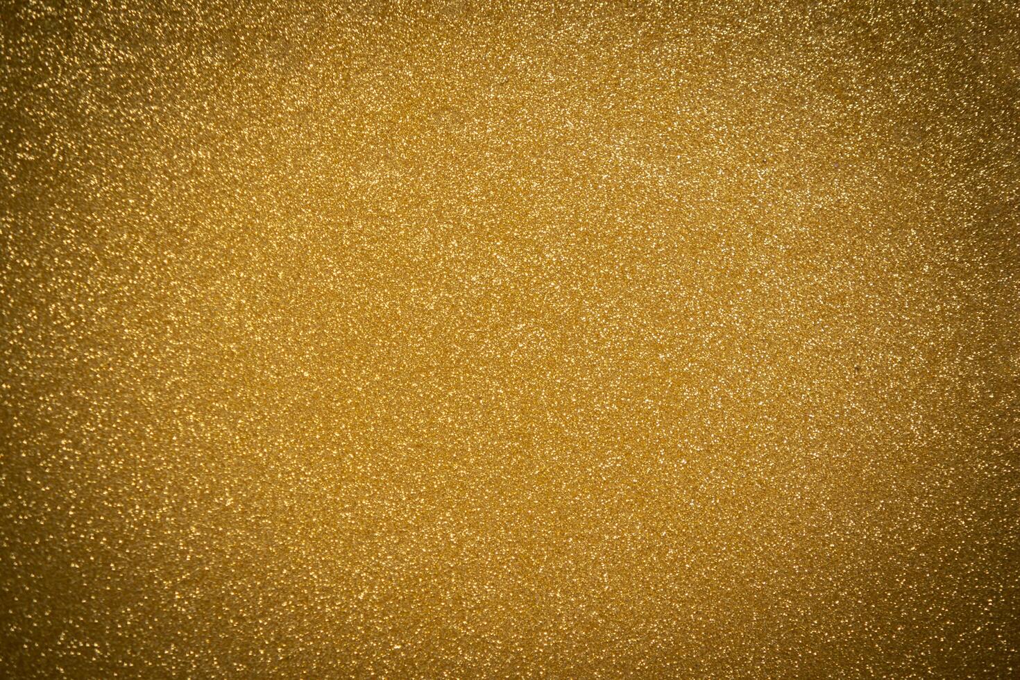 Abstract twinkled bright background with bokeh defocused golden lights photo