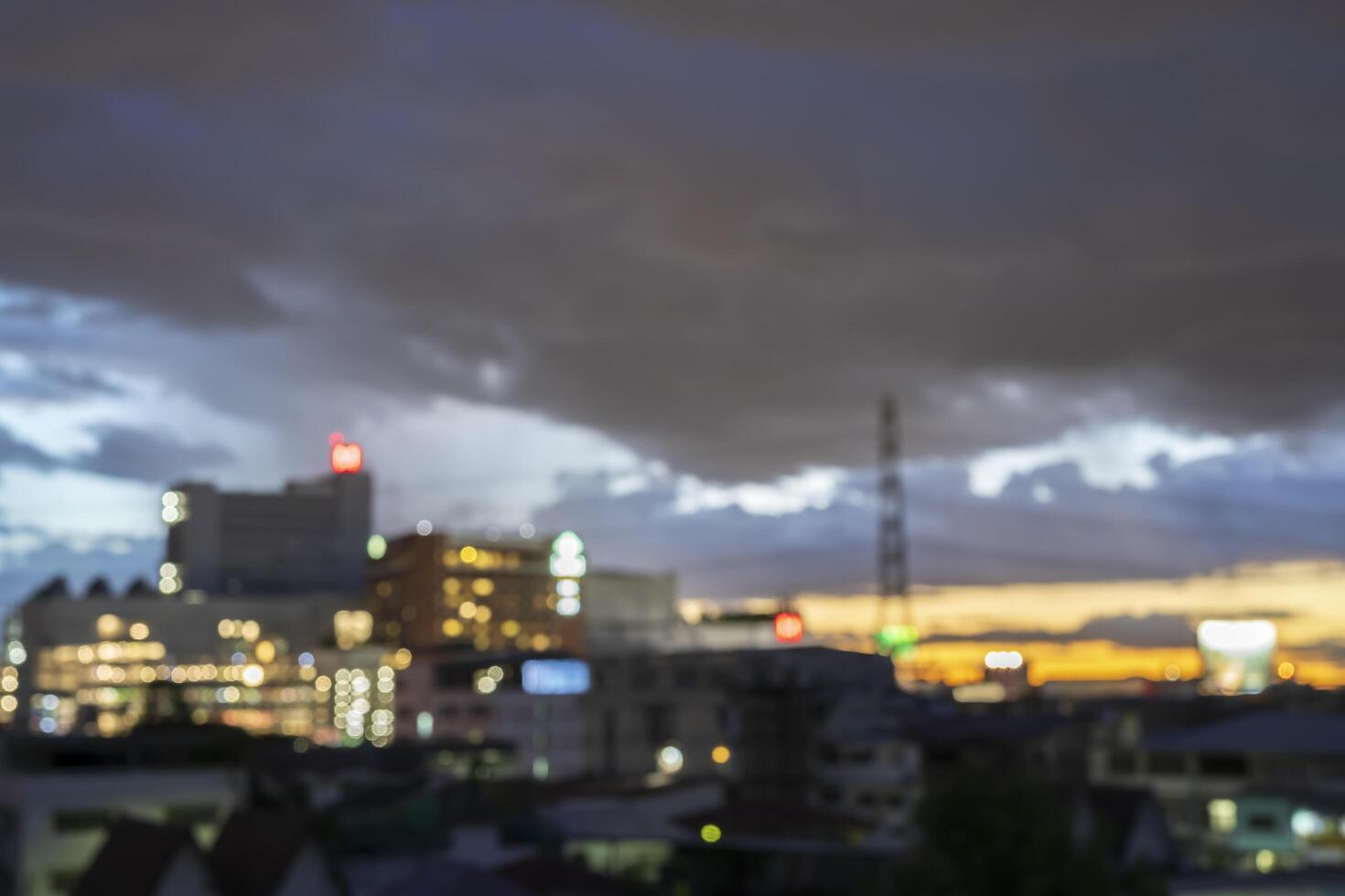 Abstract blur aerial view city on twilight color sky and clouds cityscape autumn sunrise background. photo