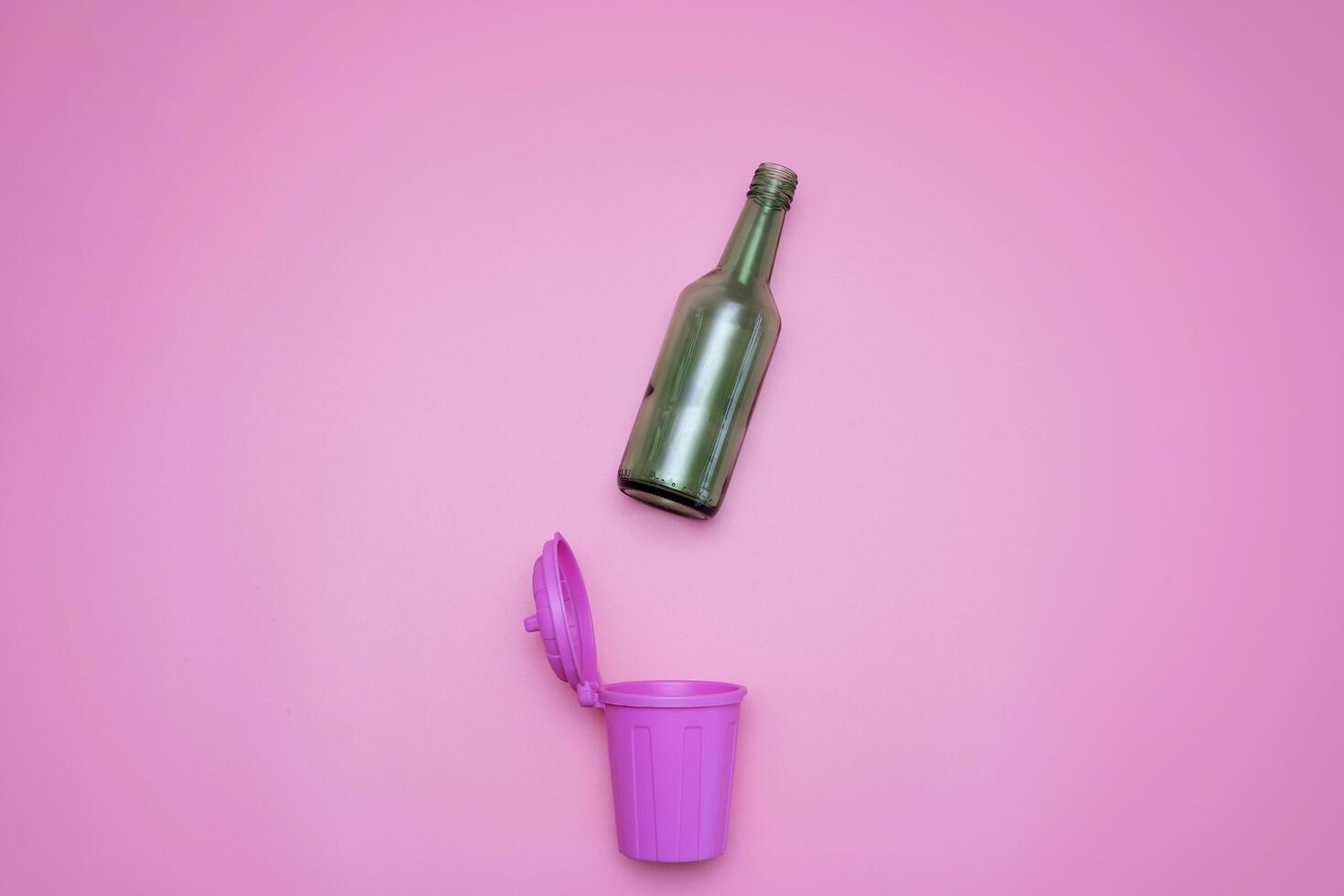 top view of trash bins and assorted garbage isolated on pink, recycle concept photo