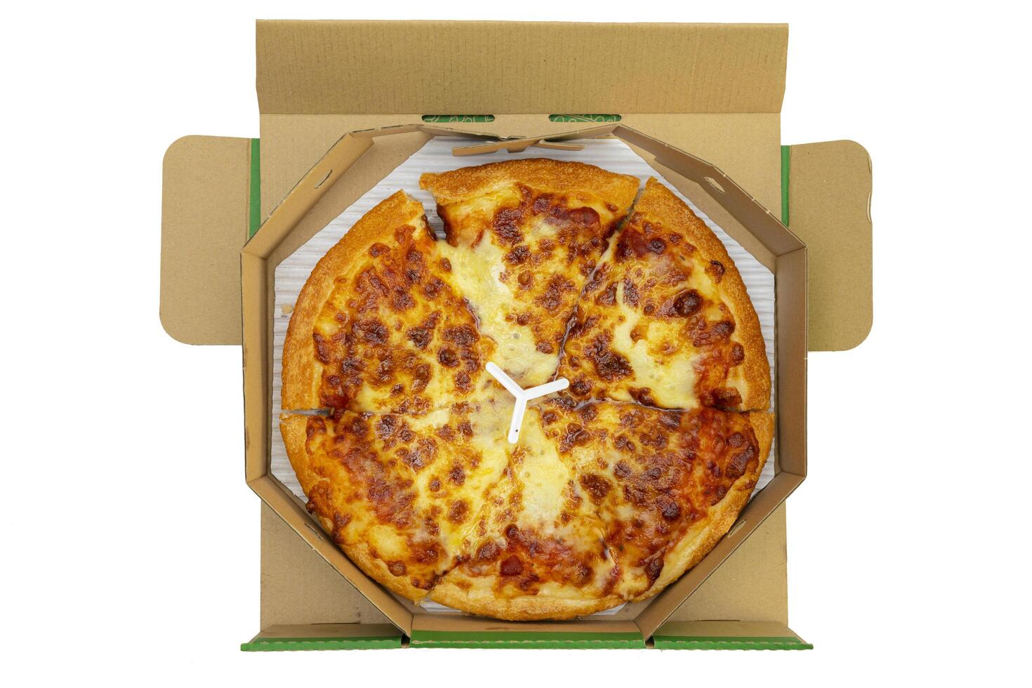 Pizza in a cardboard box against a white background. View from above. Pizza delivery. photo