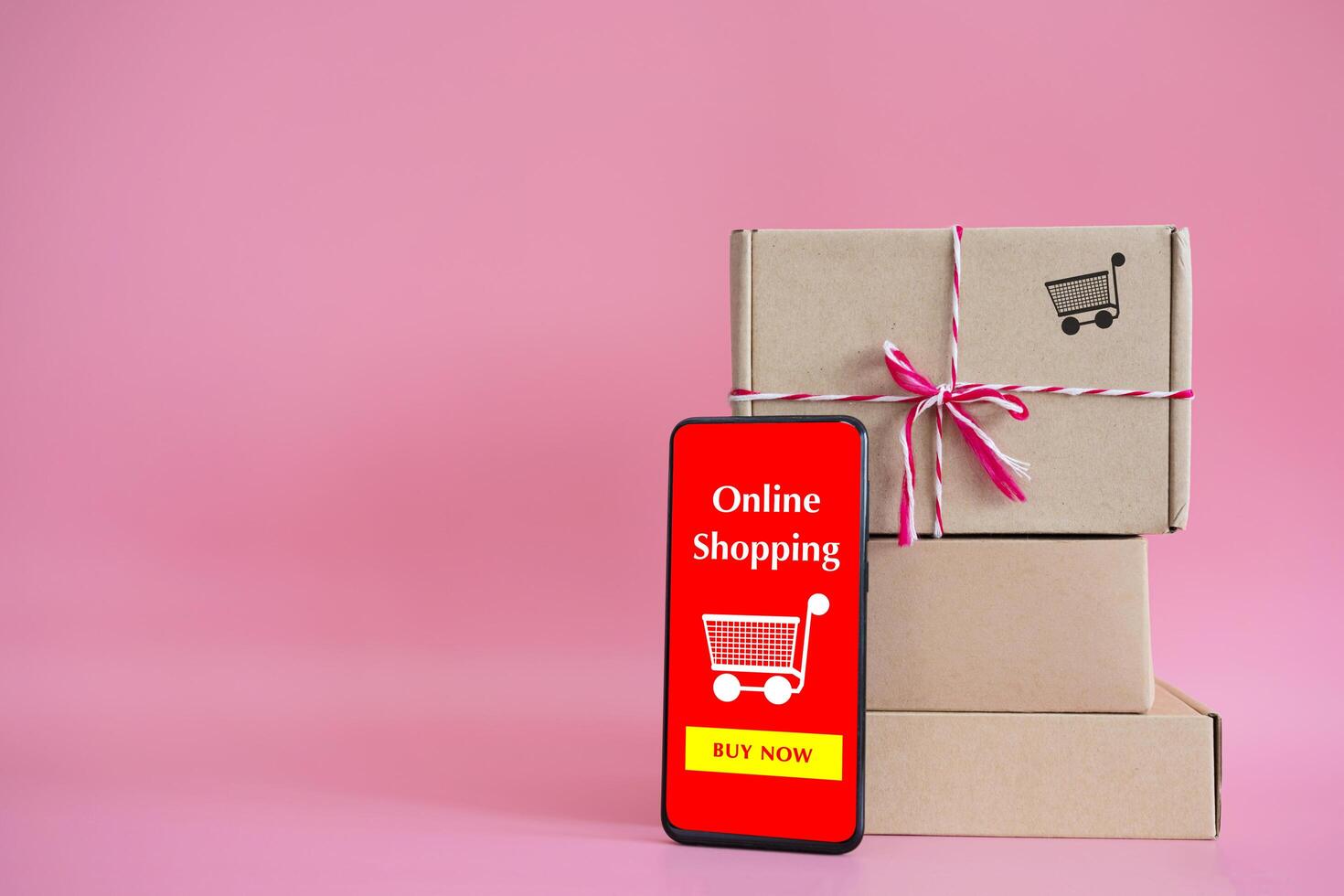 boxes and shopping bag with Smartphone Online Shopping screen photo