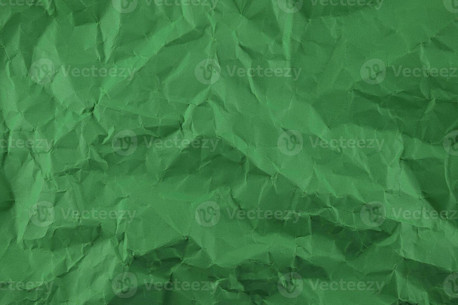 Minimal green crumpled paper texture background for Design photo