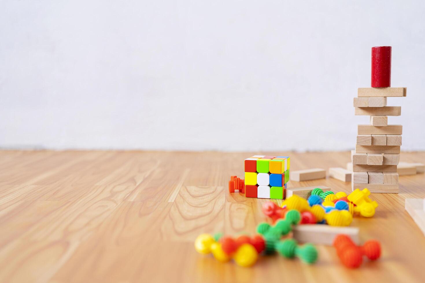 The tower of village blocks in this board game is destroyed on the table photo