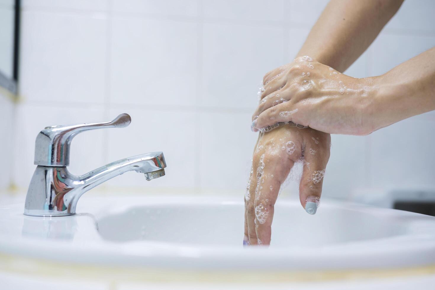 Wash your hands, soap your hands. Women's hands are washed with soap. Hand hygiene, skin care photo