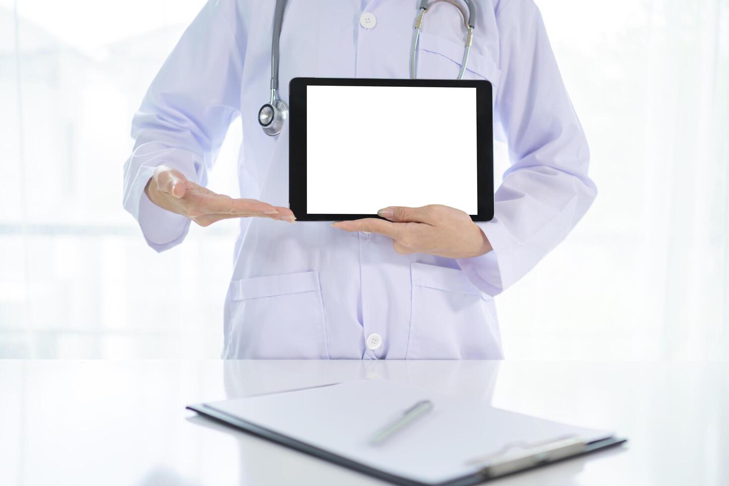 Doctor tablet computer medical with stethoscope and board photo