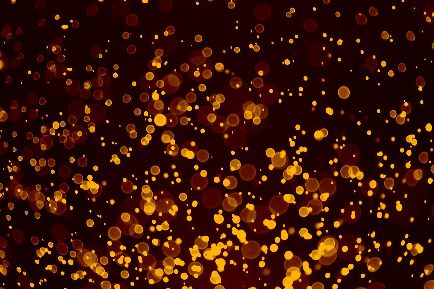 Dark gold and black glitter vintage lights background. photo