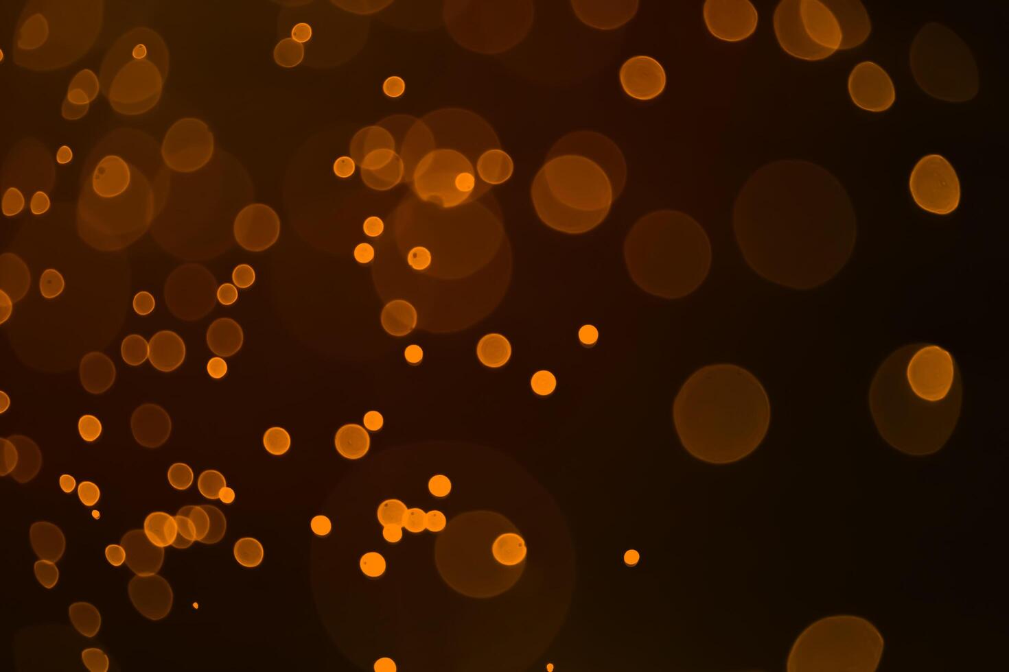 Red and orange holiday bokeh. Abstract Christmas background photo