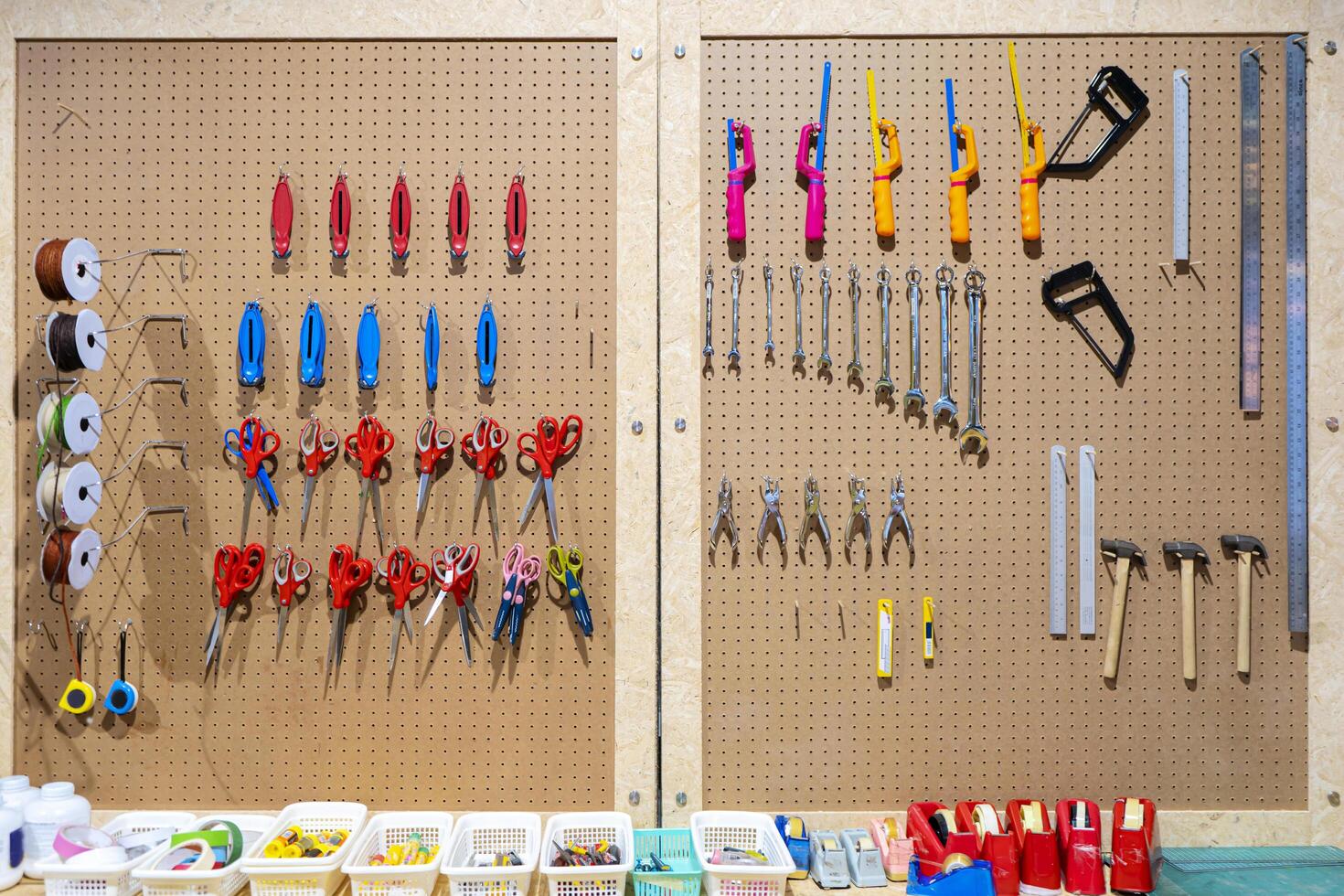 Workshop scene. Tools on the table and board. Glue, tape measure, steel ruler, screwdriver photo