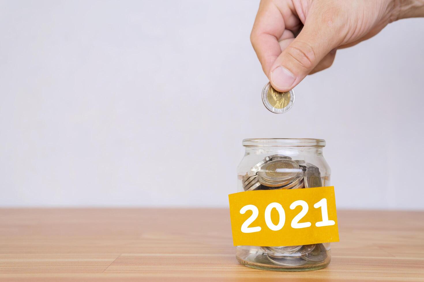 2021 New Year resolution for saving money for future in business or life. photo