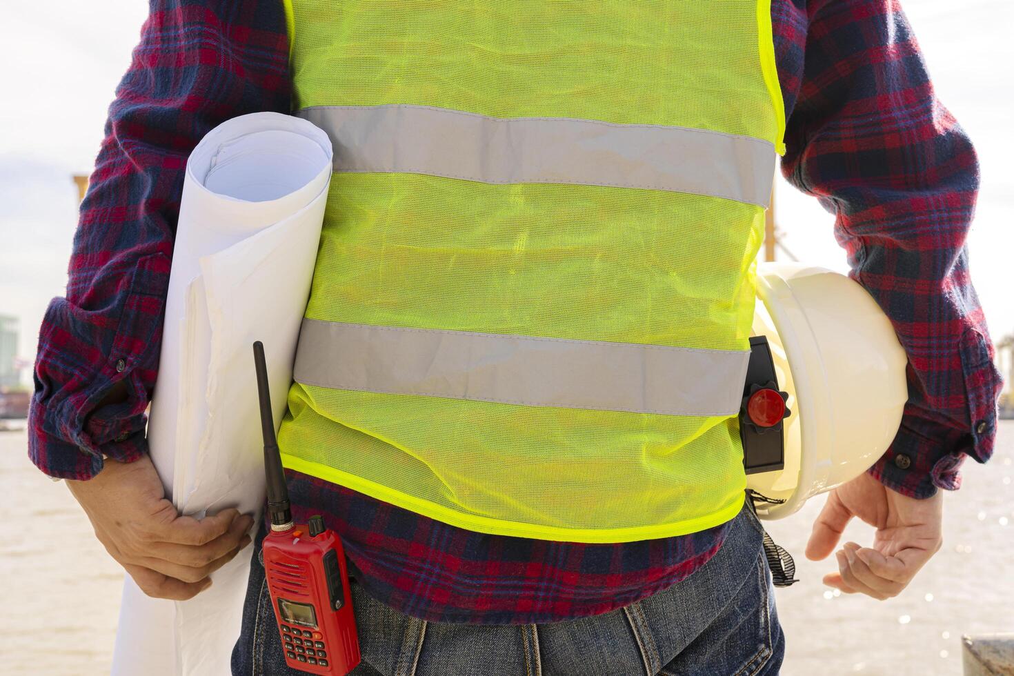 Engineers and workers inspect projects on construction site background, radio communication site photo