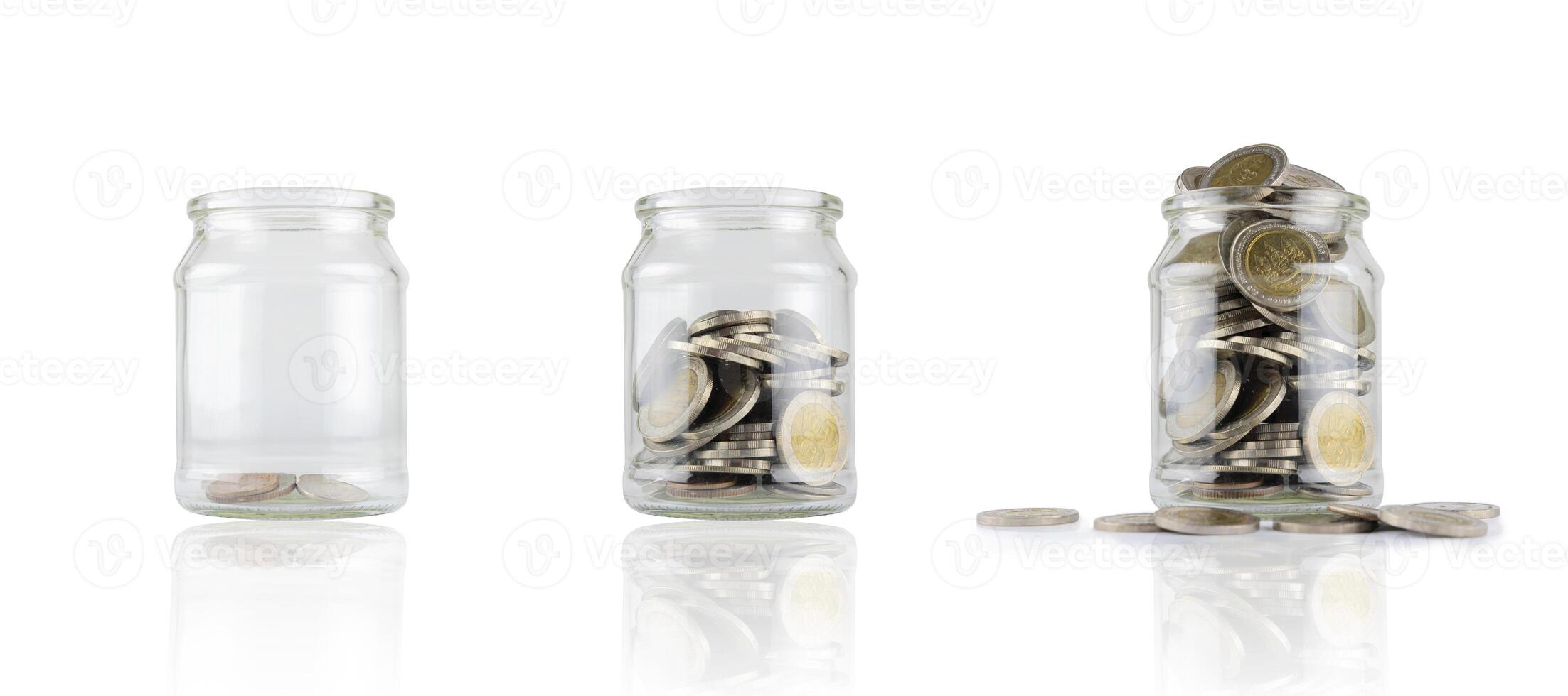 jars with different level of coins isolated on white, coins in glass photo