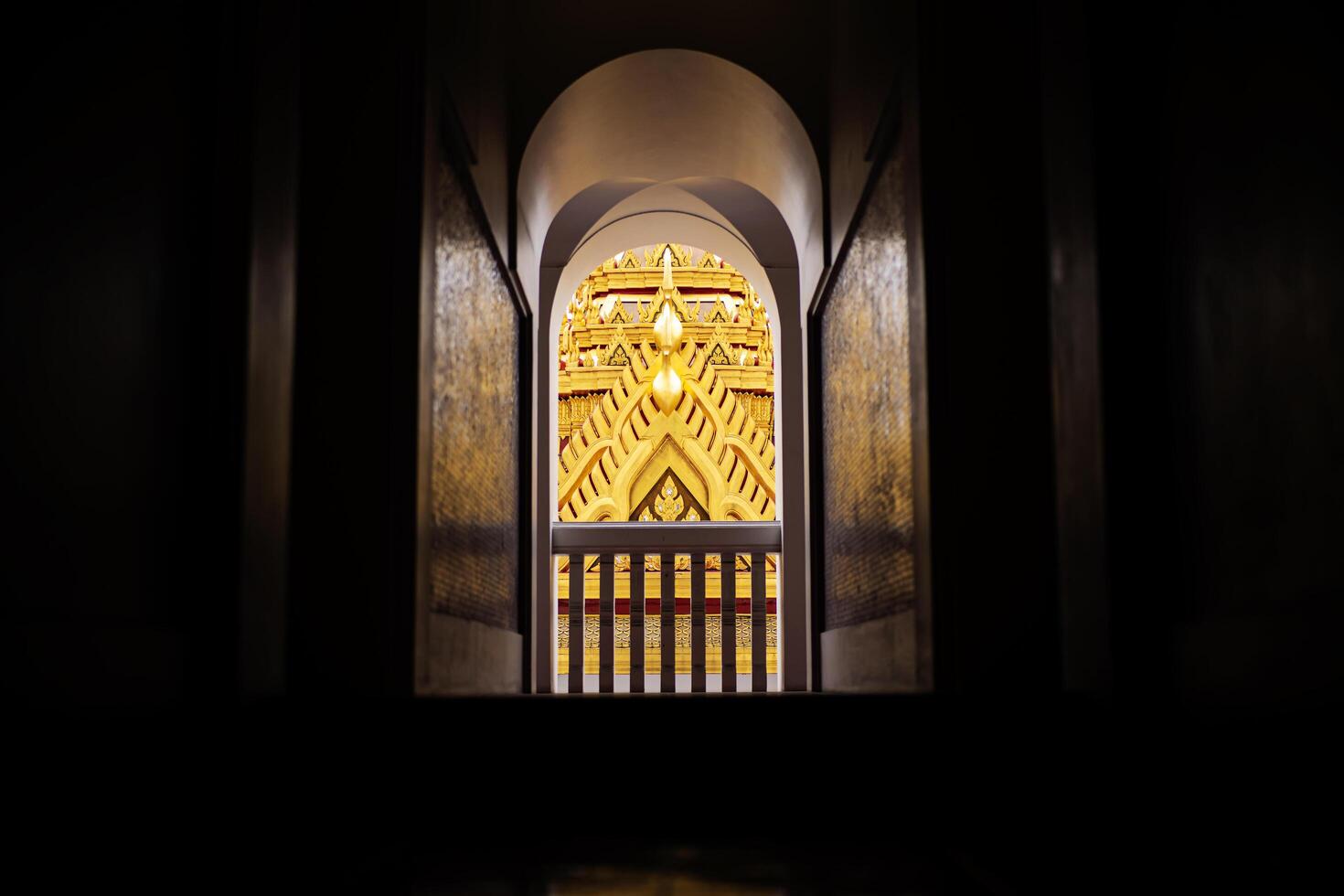 Door inside metal castle with roofs made of metal in Wat RatchanatdaTemple in Bangkok, Thailand photo