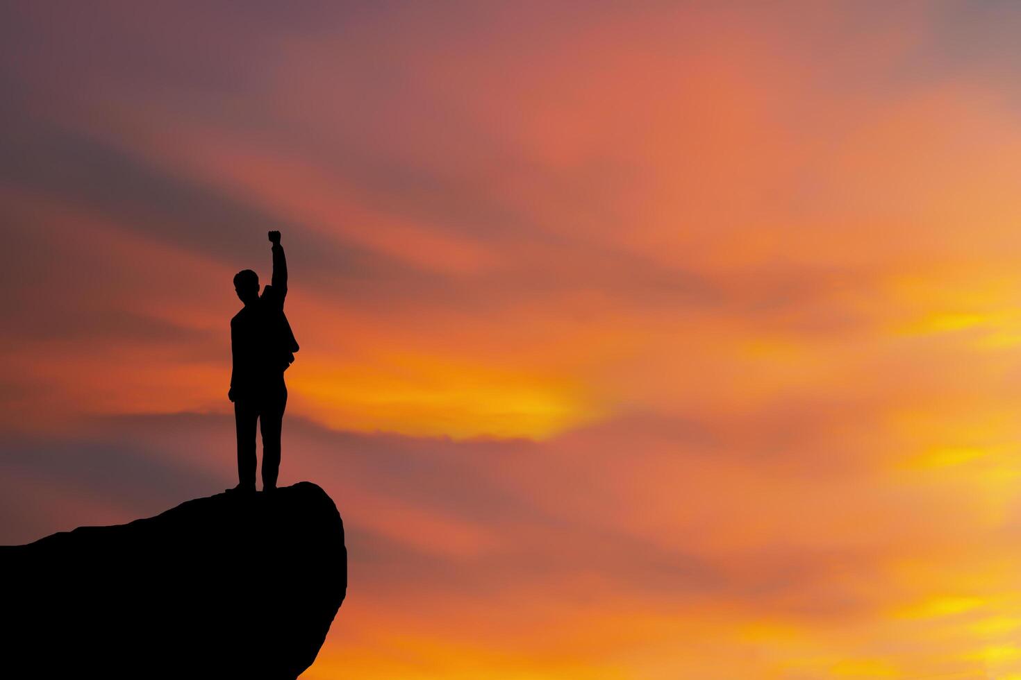 silhouette of man standing on the mountain,success concept scene. Conceptual design. photo