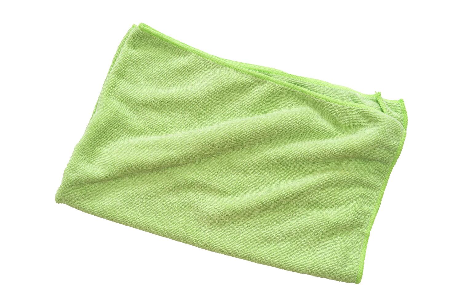 Close up of female green cloth to wipe, Fold the fabric into a square. White isolated background photo