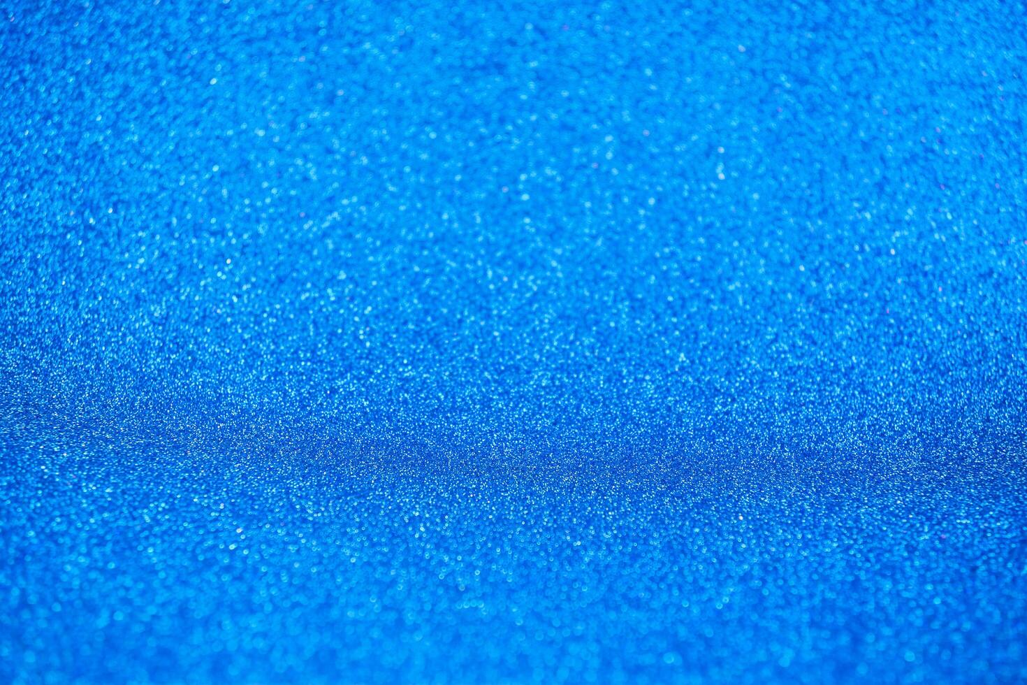 Abstract dark vivid navy blue sparkling glitter wall and floor perspective background studio with blur bokeh.luxury holiday backdrop mock up for display of product.holiday festive greeting card photo