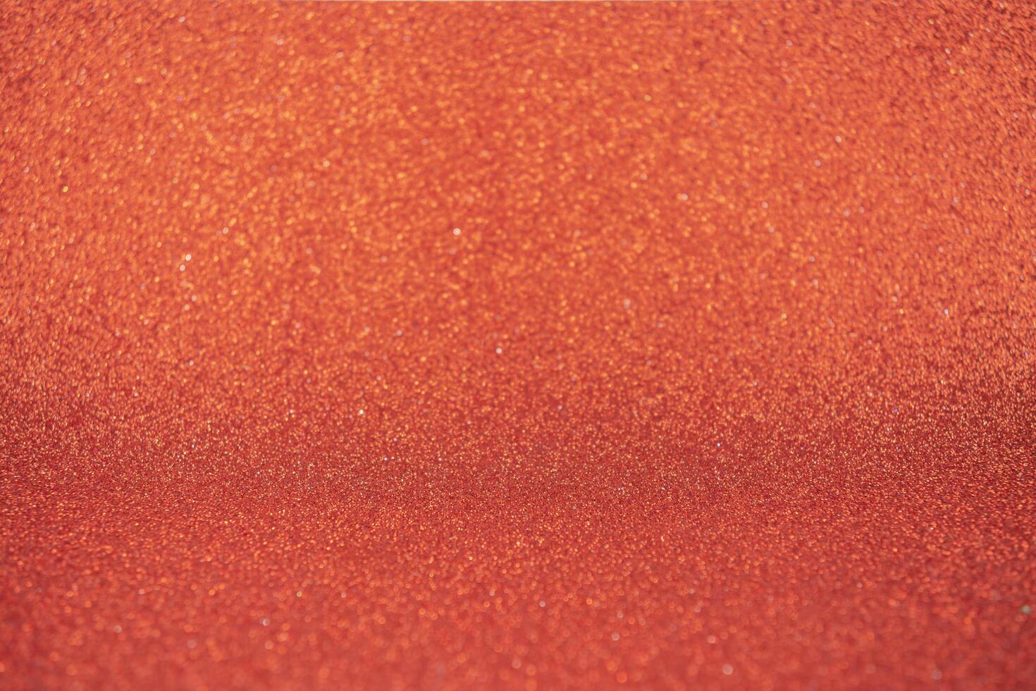Abstract orange background, glitter or bokeh lights. Round defocused particles. photo
