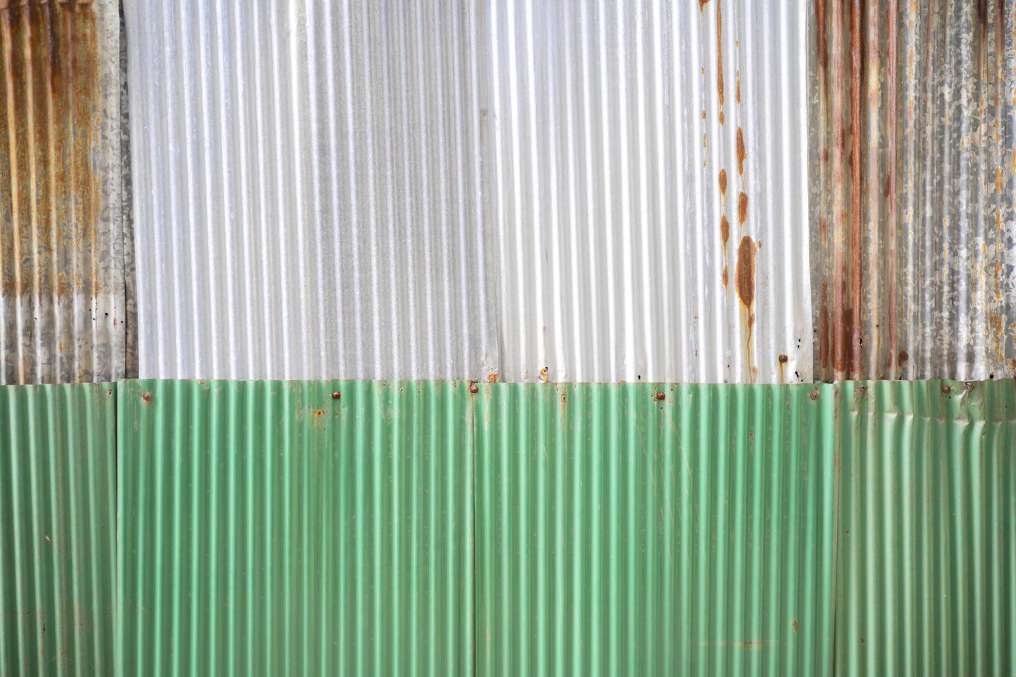 Old rusty zinc sheet wall, rusty zinc barn wall. Zinc wall pattern texture background photo